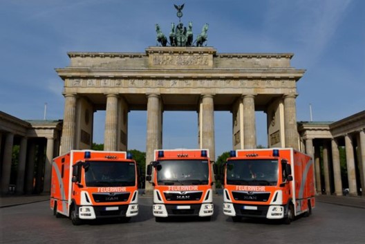 Three mobile stroke units in front of arch
